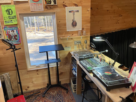 Photo of the Studio84 DJ booth with two Technics SL-1200 turntables and Mackie ProFx16v3 mixer.